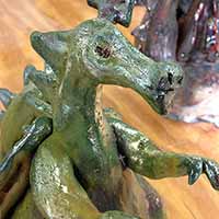 green clay dragon sculpture